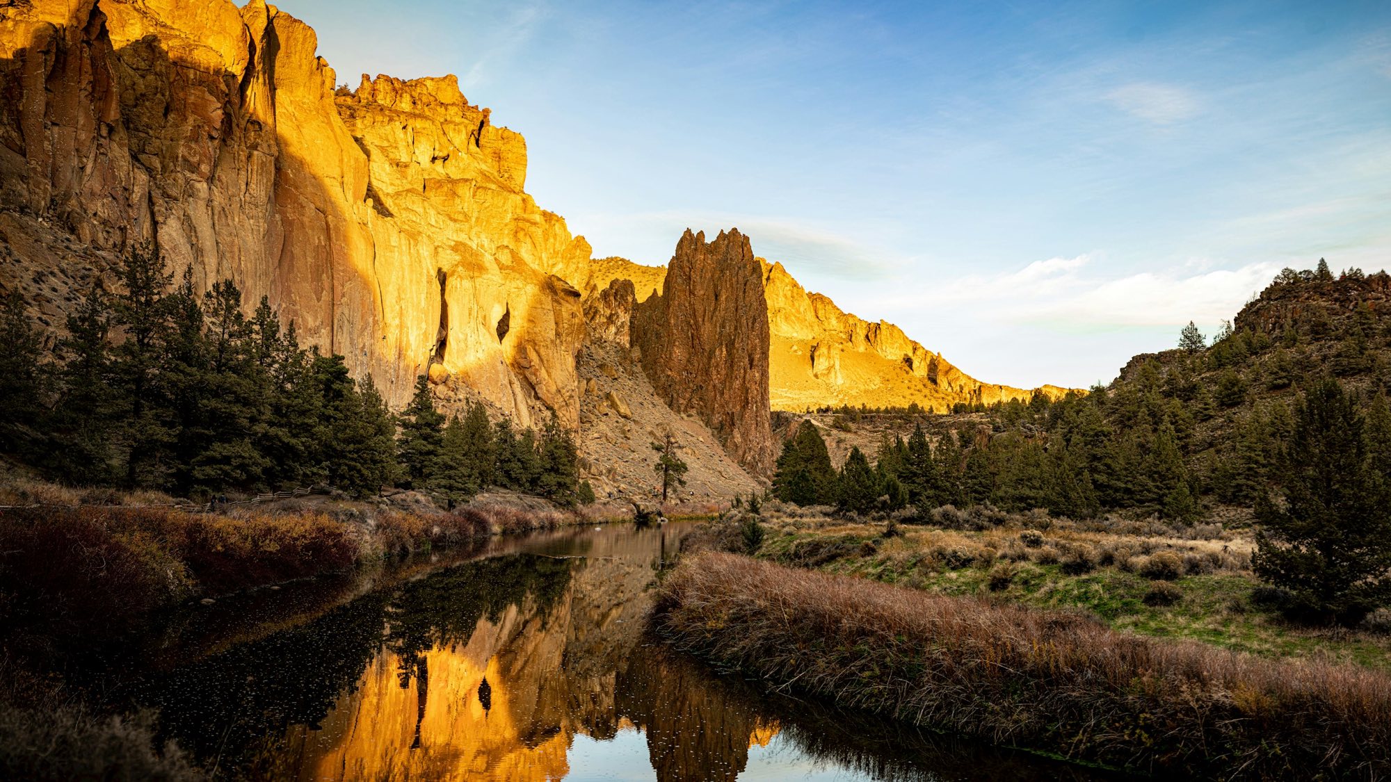 Golden cliffs at Smith Rock reflected in the Crooked River